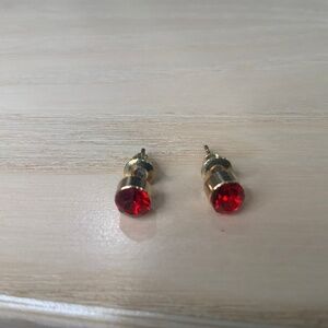 Ruby-colored stud earrings